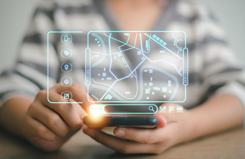 Person using smartphone with holographic GPS navigation map for real-time vehicle tracking